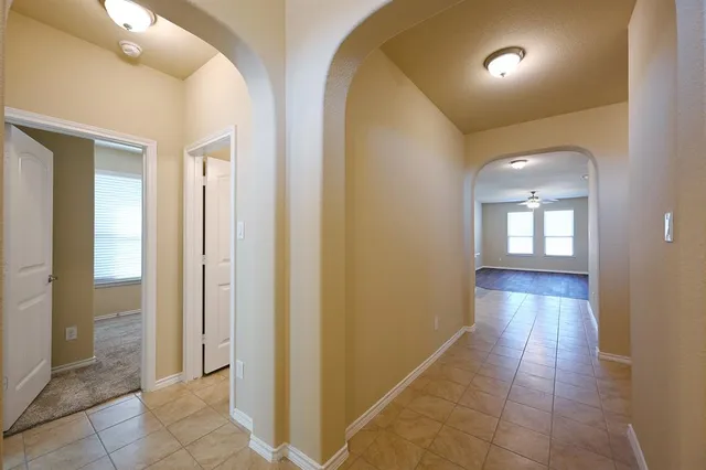 wooden floor in a room with a bathroom
