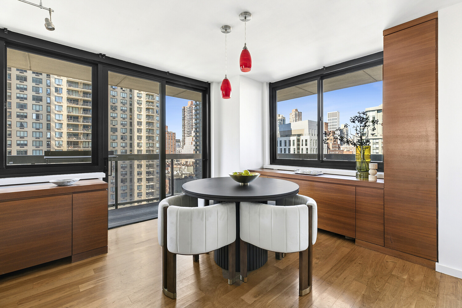 515 East 72nd Street, Unit 11L Manhattan, NY 10021 - Photo 13 of 19 a dining room with furniture and wooden floor
