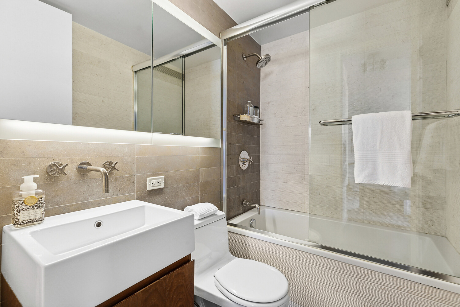 515 East 72nd Street, Unit 11L Manhattan, NY 10021 - Photo 17 of 19 a bathroom with a sink toilet and shower