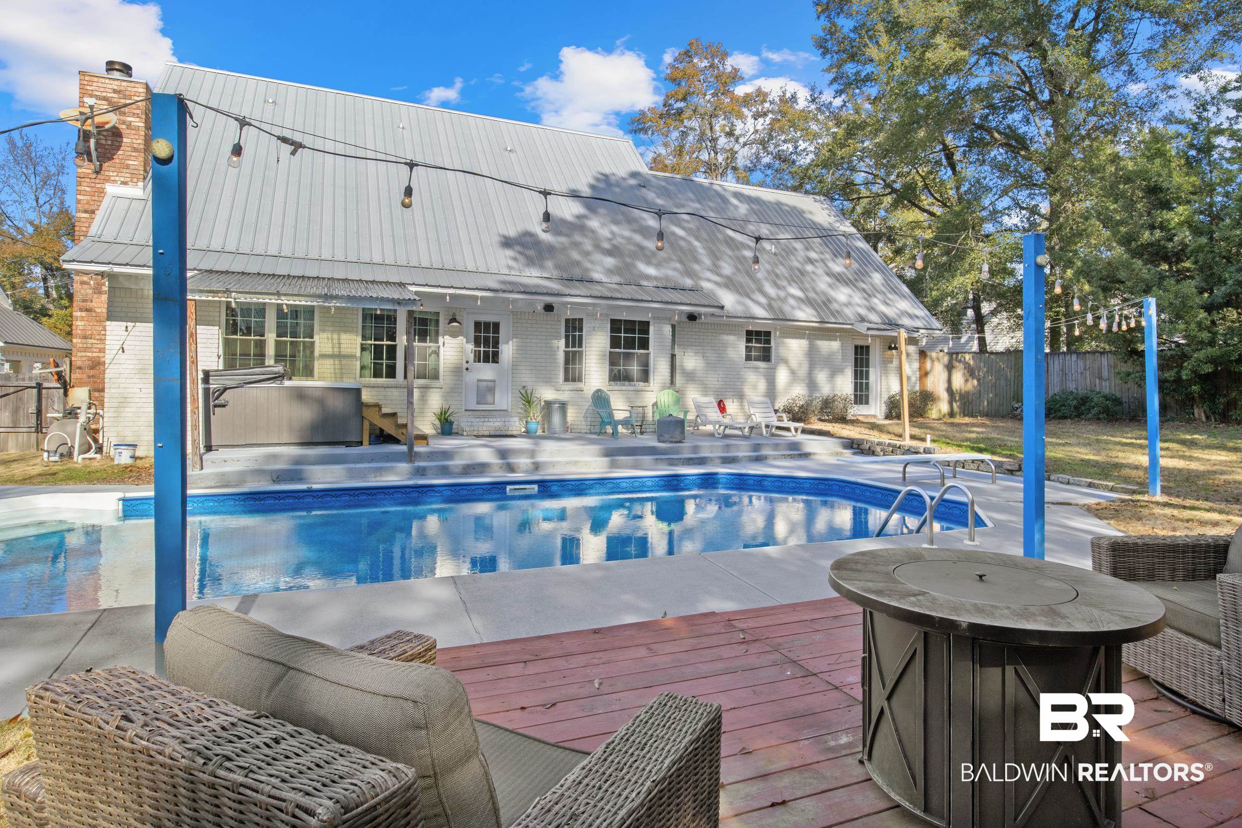 131 Marikesh Drive Daphne, AL 36526 - Photo 27 of 29 View of pool with a wooden deck, an outbuilding, grilling area, and a jacuzzi