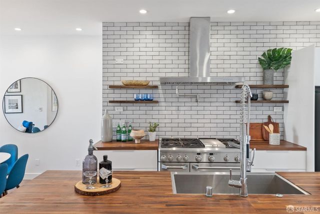 a kitchen with a sink and a stove