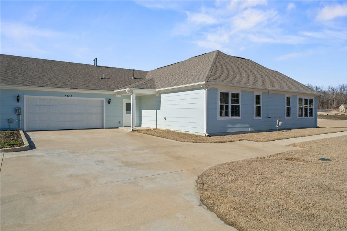 447 Abbey Road, Unit A Munford, TN 38058 - Photo 22 of 30 a view of garage with yard
