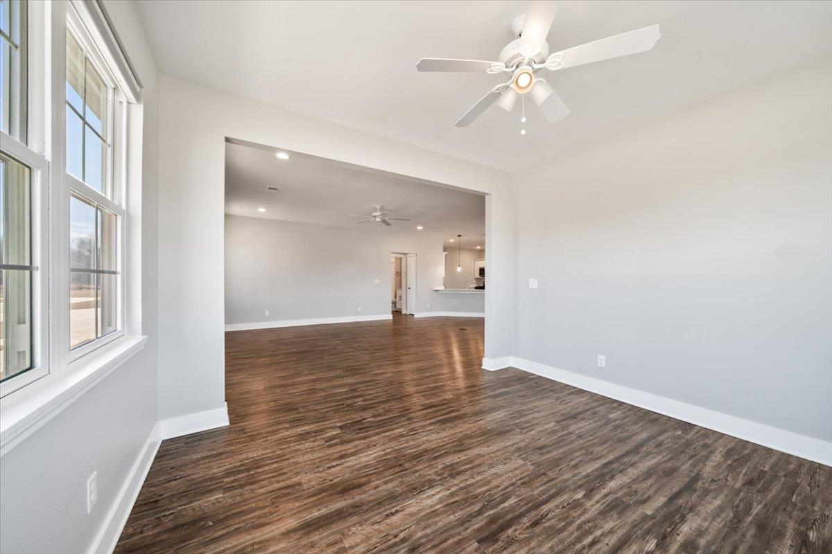 447 Abbey Road, Unit A Munford, TN 38058 - Photo 10 of 30 wooden floor in an empty room with a window