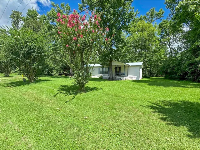 a house view with a garden space