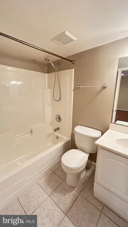 a bathroom with a toilet a sink and a shower