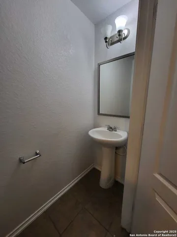 a bathroom with a sink toilet
