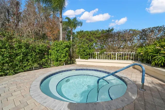 a view of a swimming pool with a yard