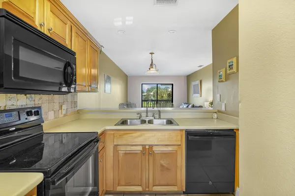 a kitchen with a stove and a sink