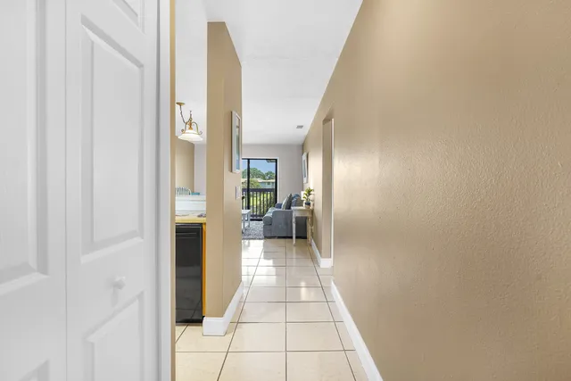 a view of an empty room and wooden floor