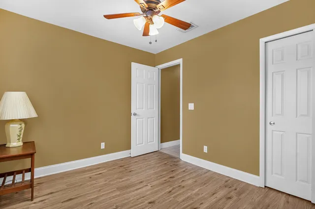 a bathroom with a toilet sink vanity tub and shower