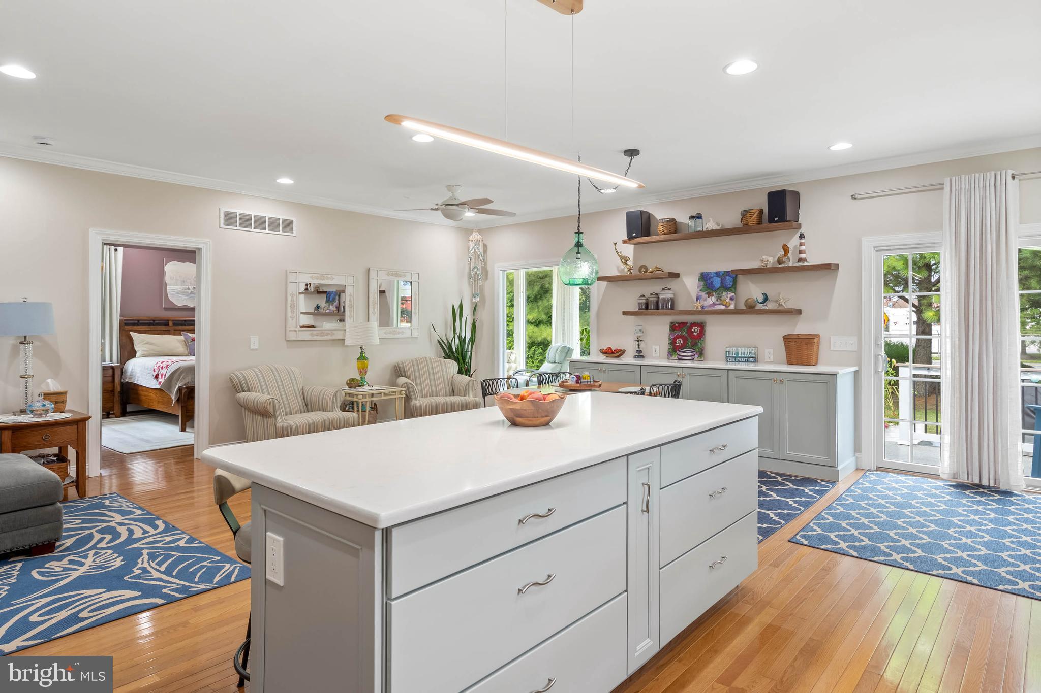 20234 Whitehead Circle, Unit 100 Rehoboth Beach, DE 19971 - Photo 13 of 40 a kitchen with a sink and cabinets