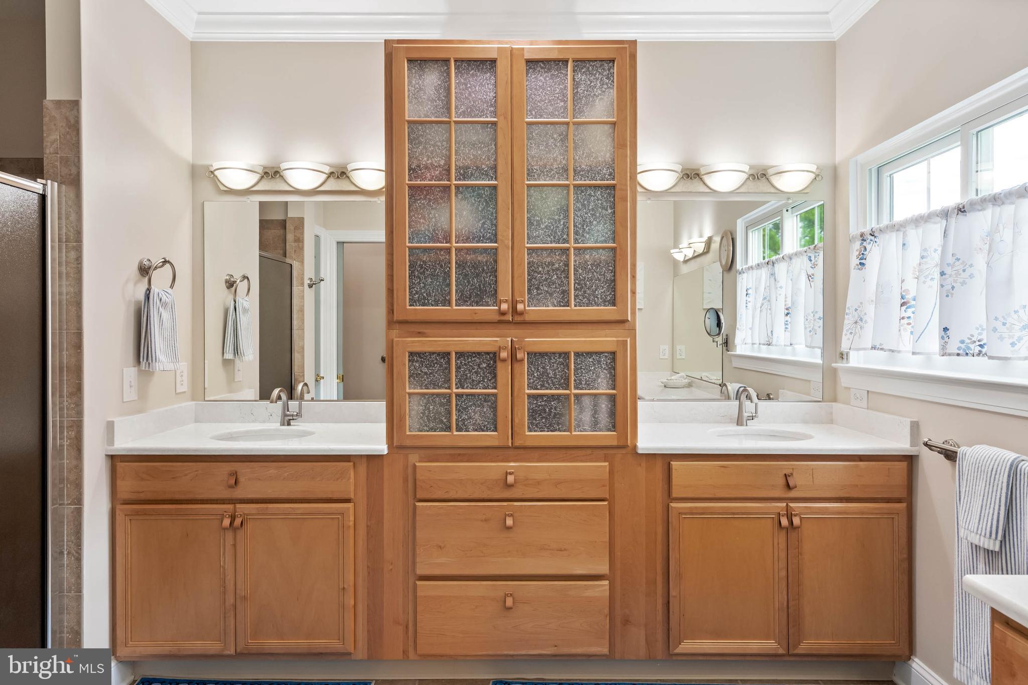 20234 Whitehead Circle, Unit 100 Rehoboth Beach, DE 19971 - Photo 19 of 40 Double Vanity w/ Built-in Cupboard