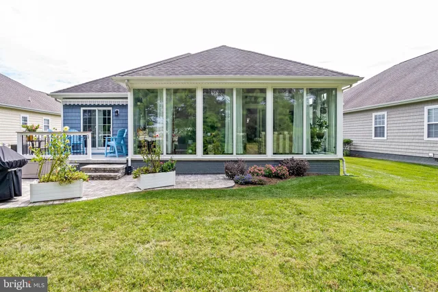 an aerial view of residential house with outdoor space and lake view