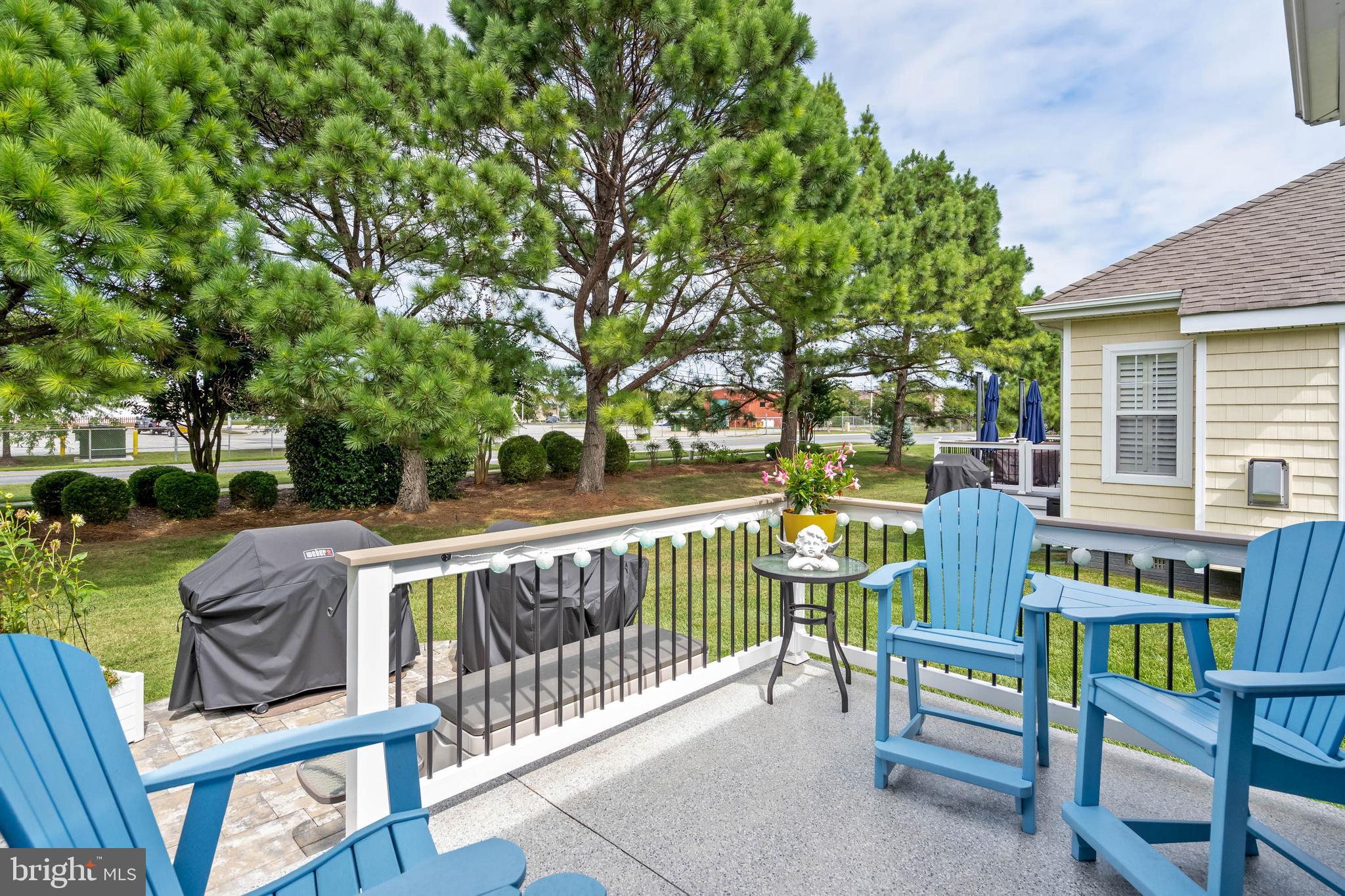 20234 Whitehead Circle, Unit 100 Rehoboth Beach, DE 19971 - Photo 31 of 40 a view of deck with chairs and wooden fence