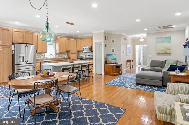 a kitchen with stainless steel appliances a refrigerator sink and stove