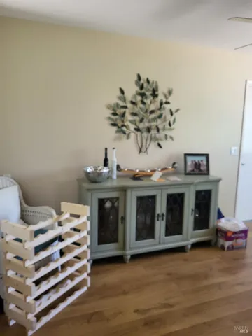 a view of a livingroom with furniture and staircase