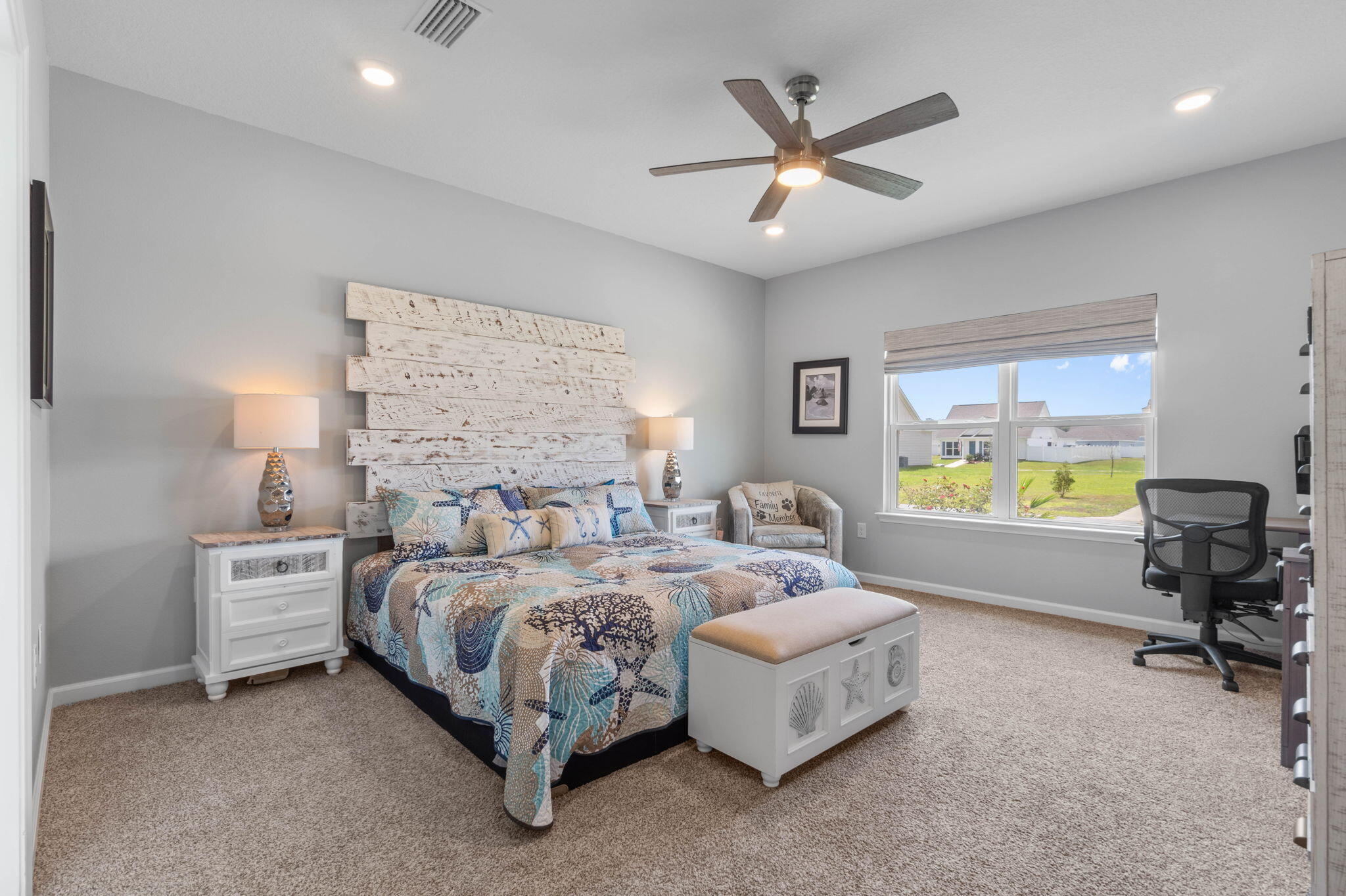38 Silverthorn Street Freeport, FL 32439 - Photo 18 of 42 a bedroom with a bed and a large window