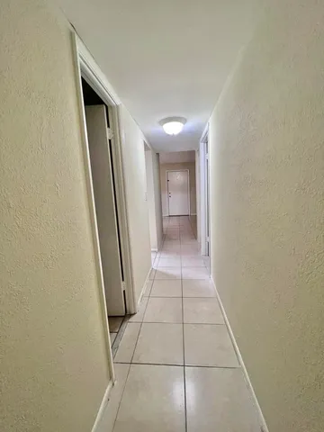 a view of hallway with shower