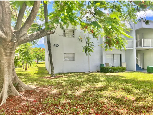a view of a trees in front of a house