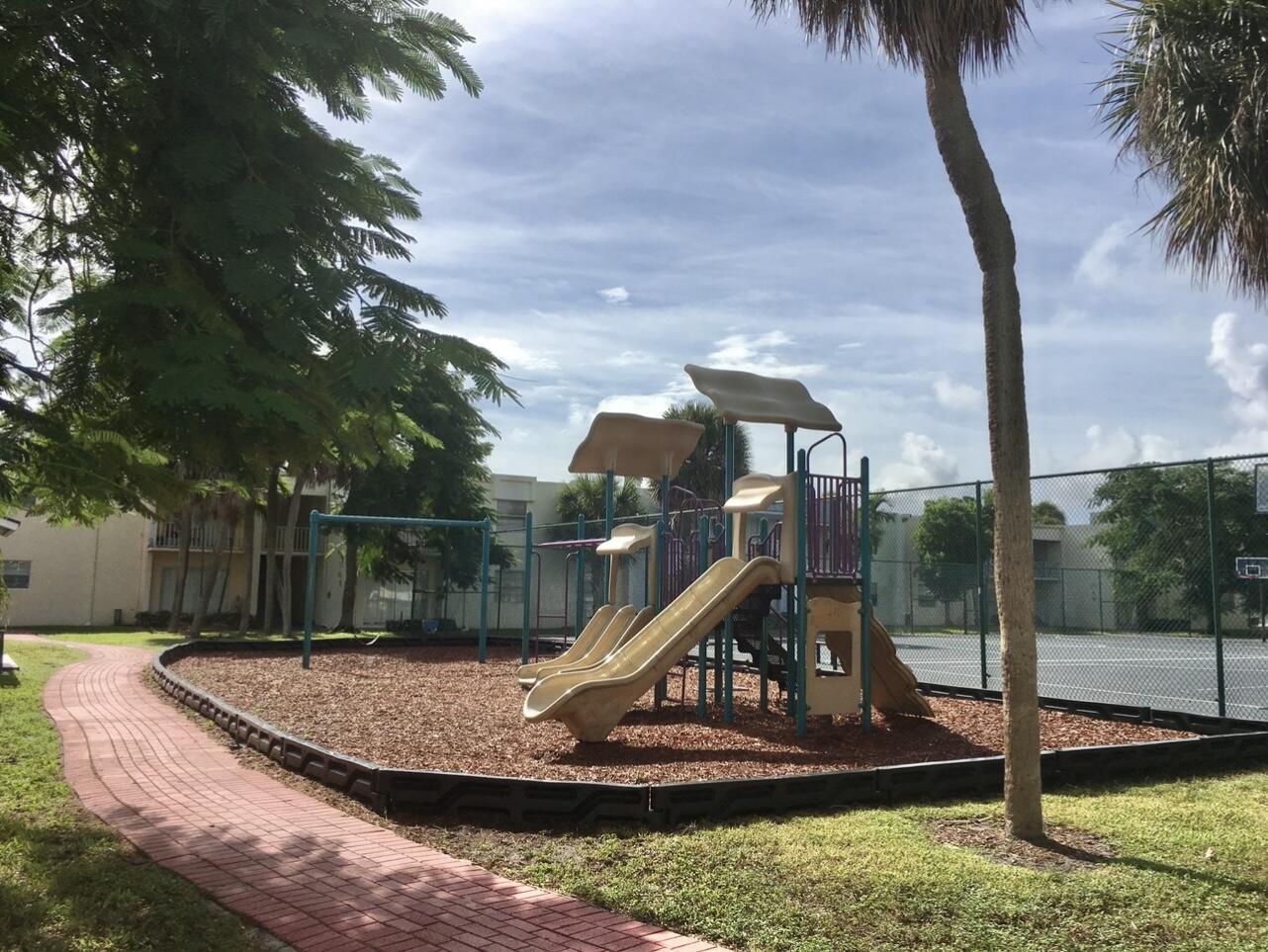 415 Executive Center Drive, Unit 213 West Palm Beach, FL 33401 - Photo 22 of 23 a view of a park with slide