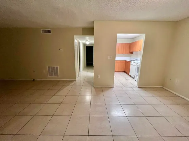 a view of a storage & utility room with a sink