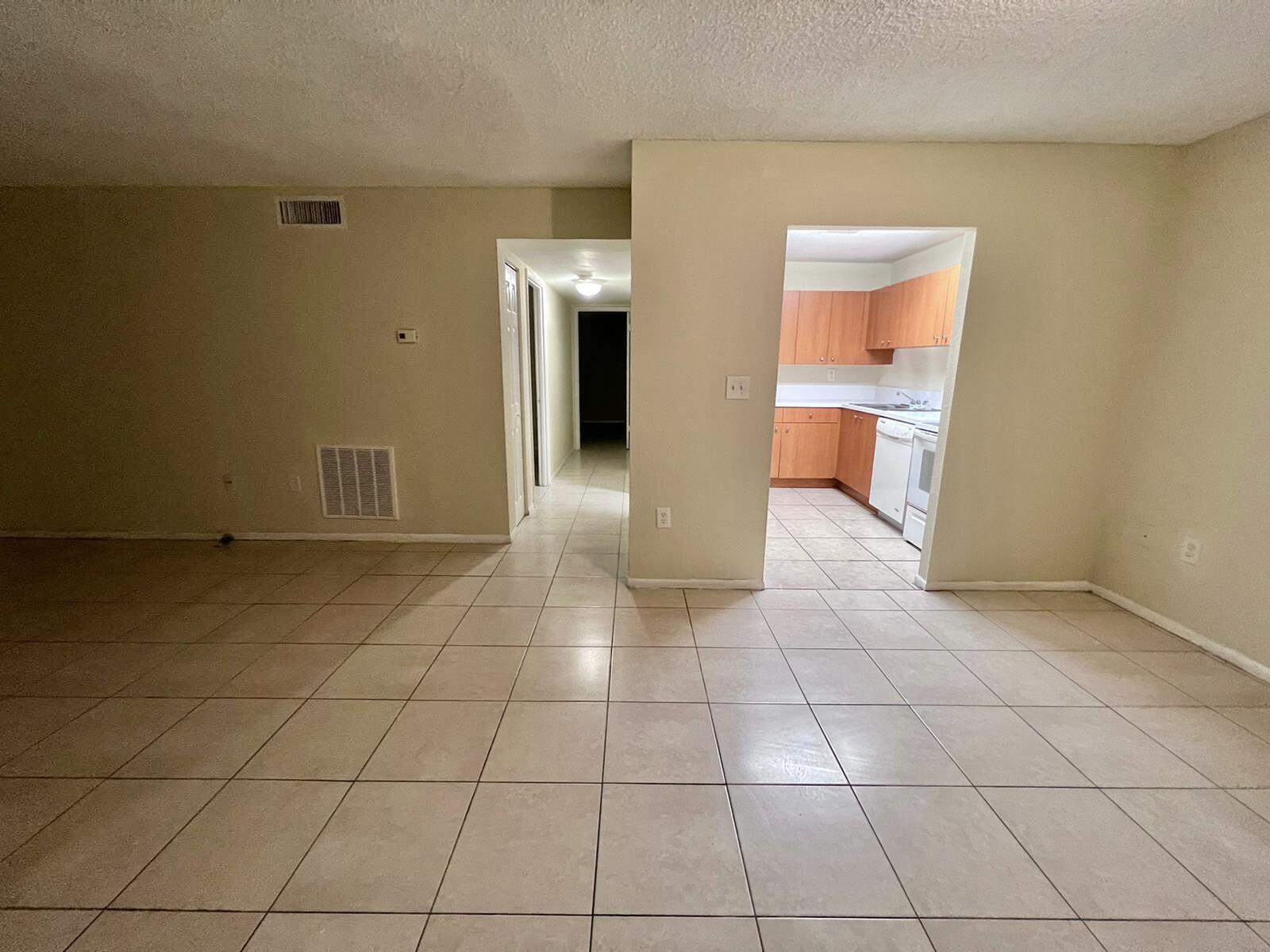 415 Executive Center Drive, Unit 213 West Palm Beach, FL 33401 - Photo 8 of 23 a view of a storage & utility room with a sink