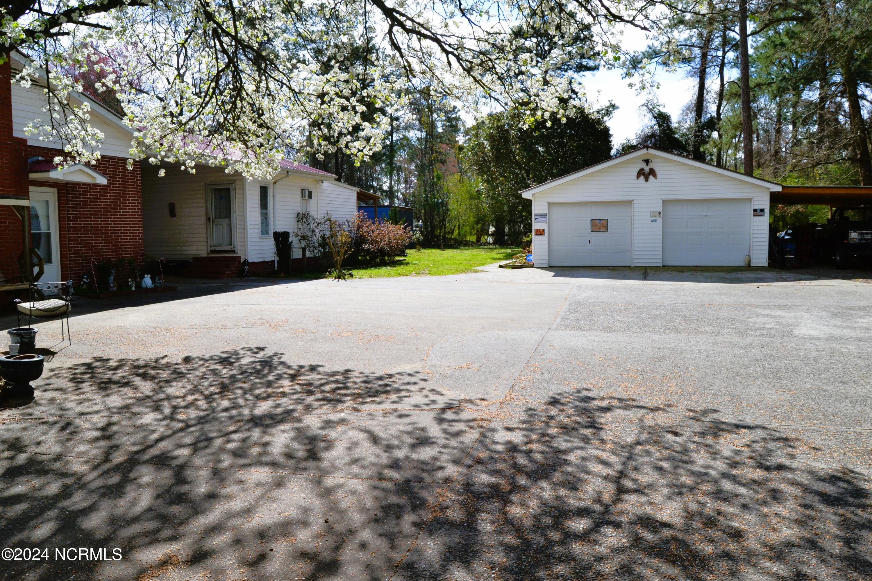 749 Hallsville Road Beulaville, NC 28518 - Photo 31 of 32 Additional 4 car fully equipped garage with storage.