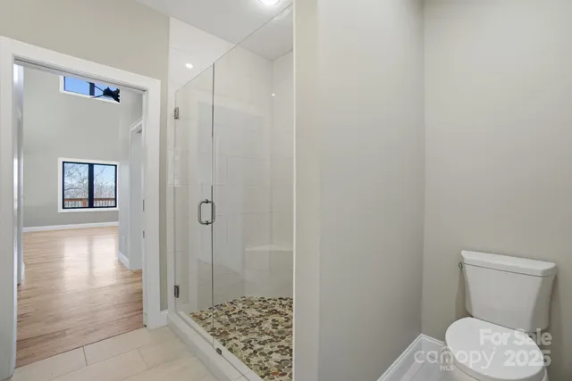 a kitchen with granite countertop a sink stove and cabinets