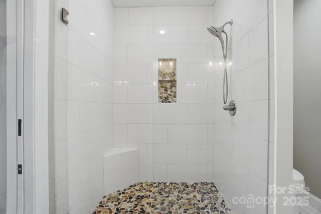 a kitchen with granite countertop cabinets a sink and a stove