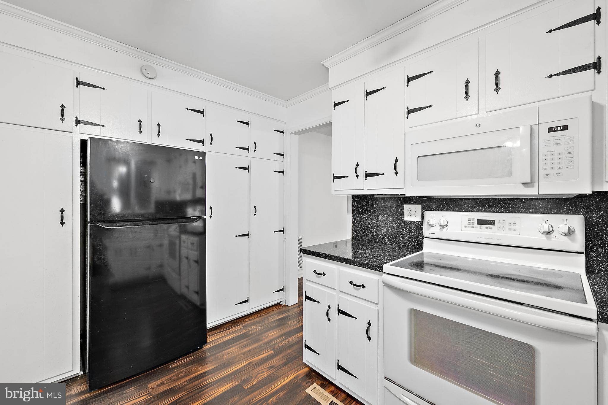 6181 Rockawalkin Road Salisbury, MD 21801 - Photo 20 of 65 a kitchen with stainless steel appliances a refrigerator stove and cabinets