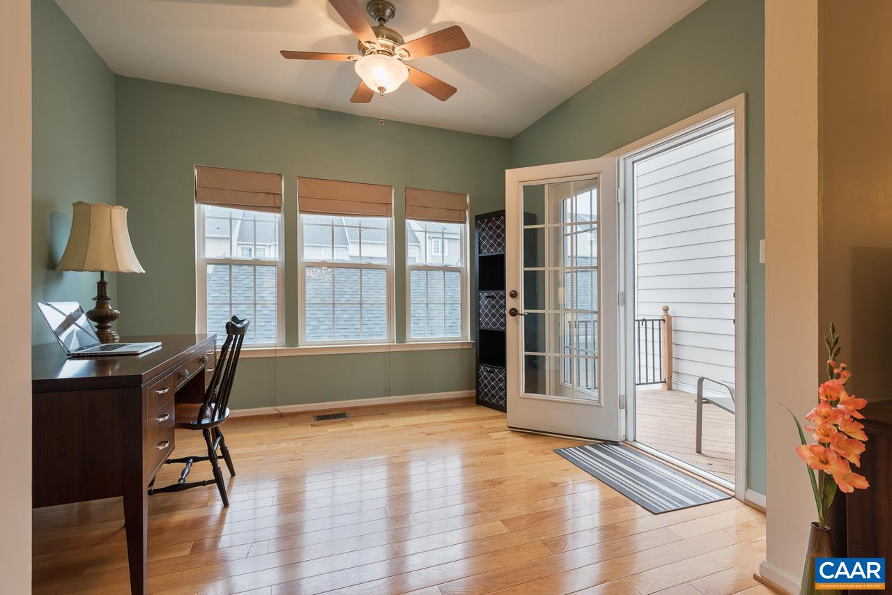711 Rainier Road Charlottesville, VA 22903 - Photo 11 of 17 a view of a workspace with furniture and a window