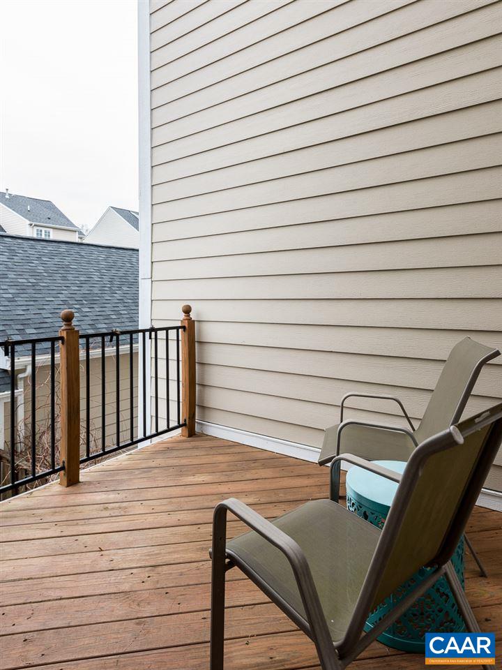 711 Rainier Road Charlottesville, VA 22903 - Photo 12 of 17 a view of a balcony with chair and table