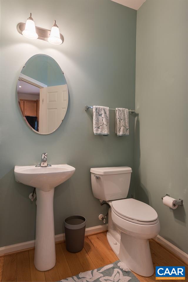 711 Rainier Road Charlottesville, VA 22903 - Photo 13 of 17 a bathroom with a toilet a sink and a mirror