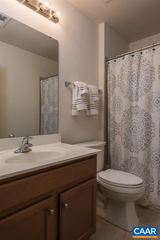 711 Rainier Road Charlottesville, VA 22903 - Photo 17 of 17 a bathroom with a sink a toilet and shower