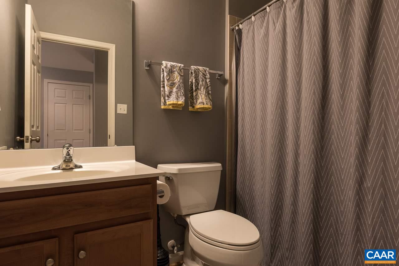 711 Rainier Road Charlottesville, VA 22903 - Photo 4 of 17 a bathroom with a sink a toilet and shower