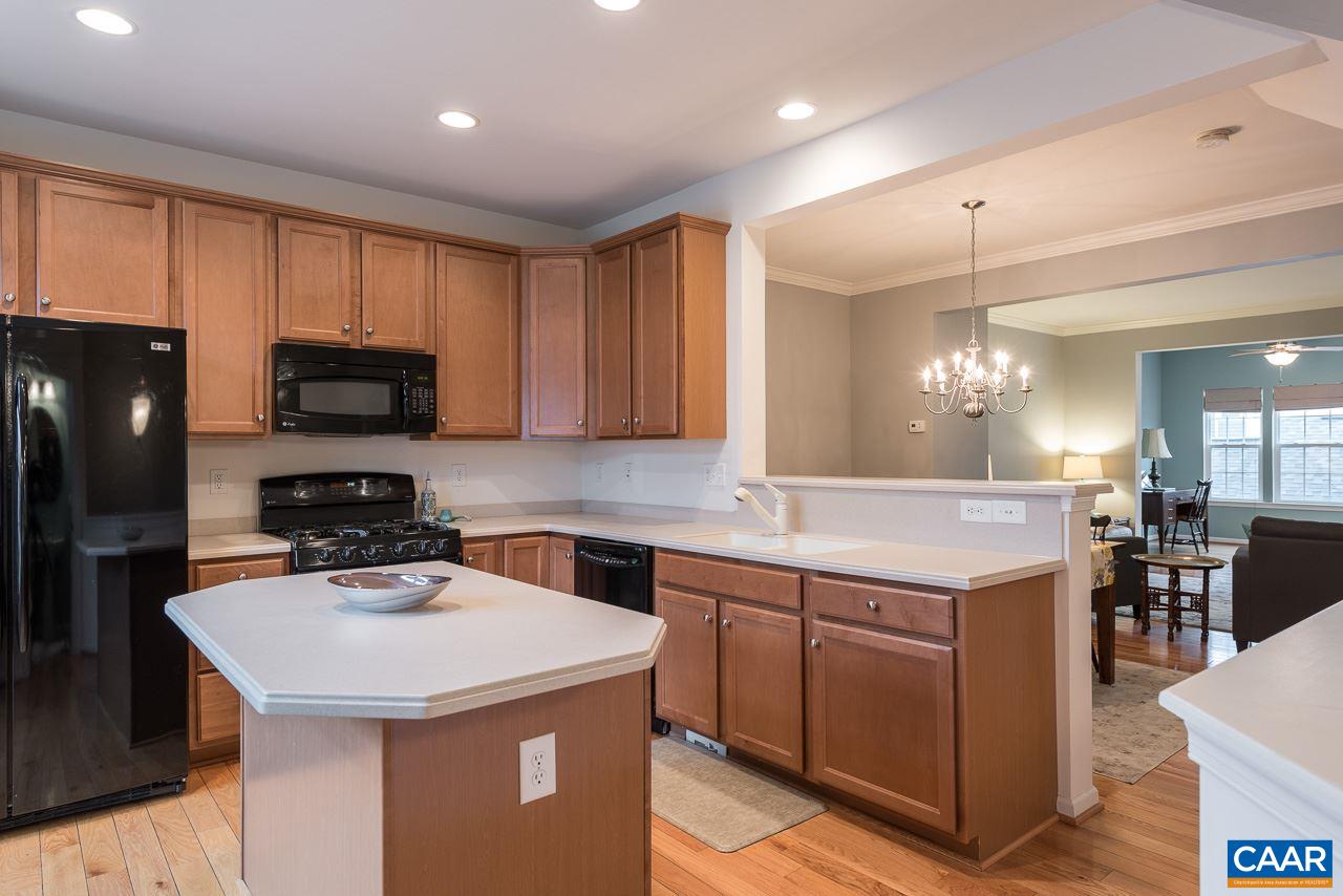 711 Rainier Road Charlottesville, VA 22903 - Photo 8 of 17 a kitchen with a sink a stove a refrigerator and a refrigerator