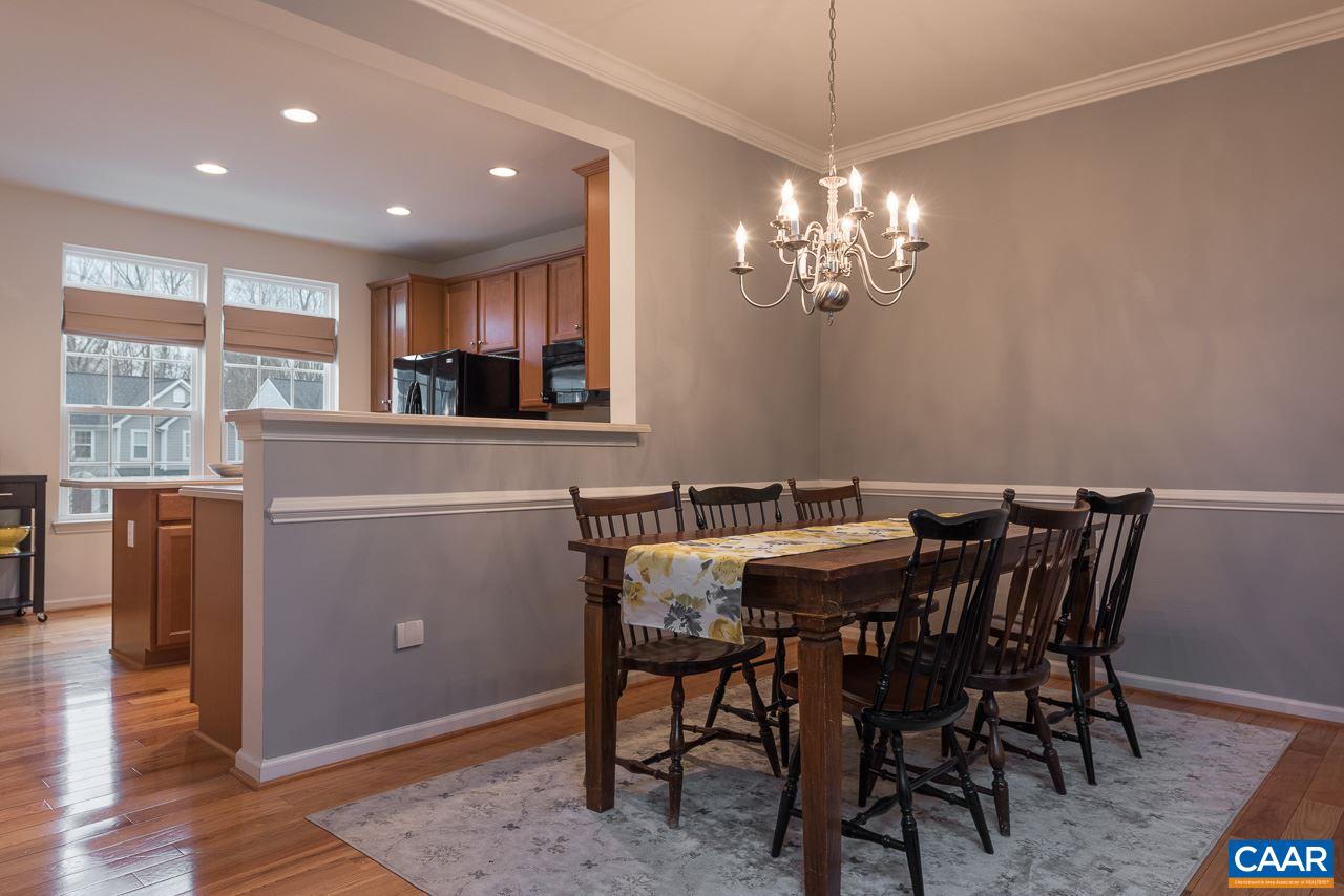 711 Rainier Road Charlottesville, VA 22903 - Photo 9 of 17 a view of a dining room with furniture window and wooden floor