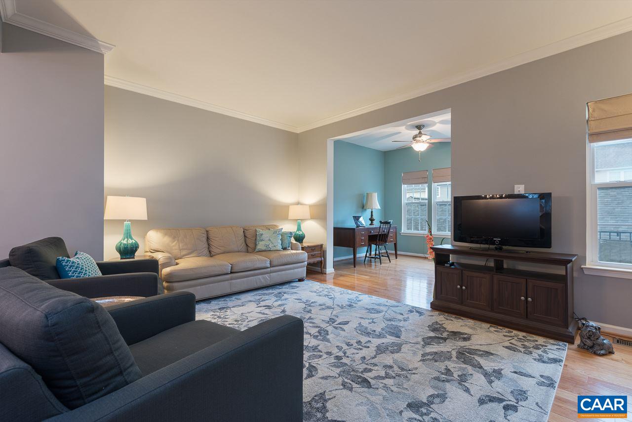 711 Rainier Road Charlottesville, VA 22903 - Photo 10 of 17 a living room with furniture and a flat screen tv