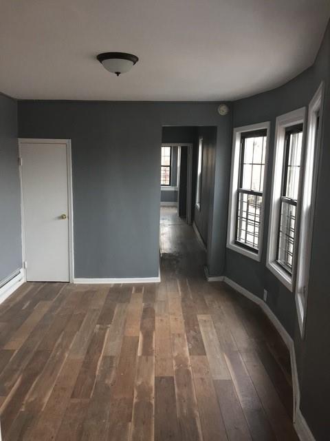 3324 Tilden Avenue Brooklyn, NY 11203 - Photo 8 of 8 a view of an empty room with glass door and windows
