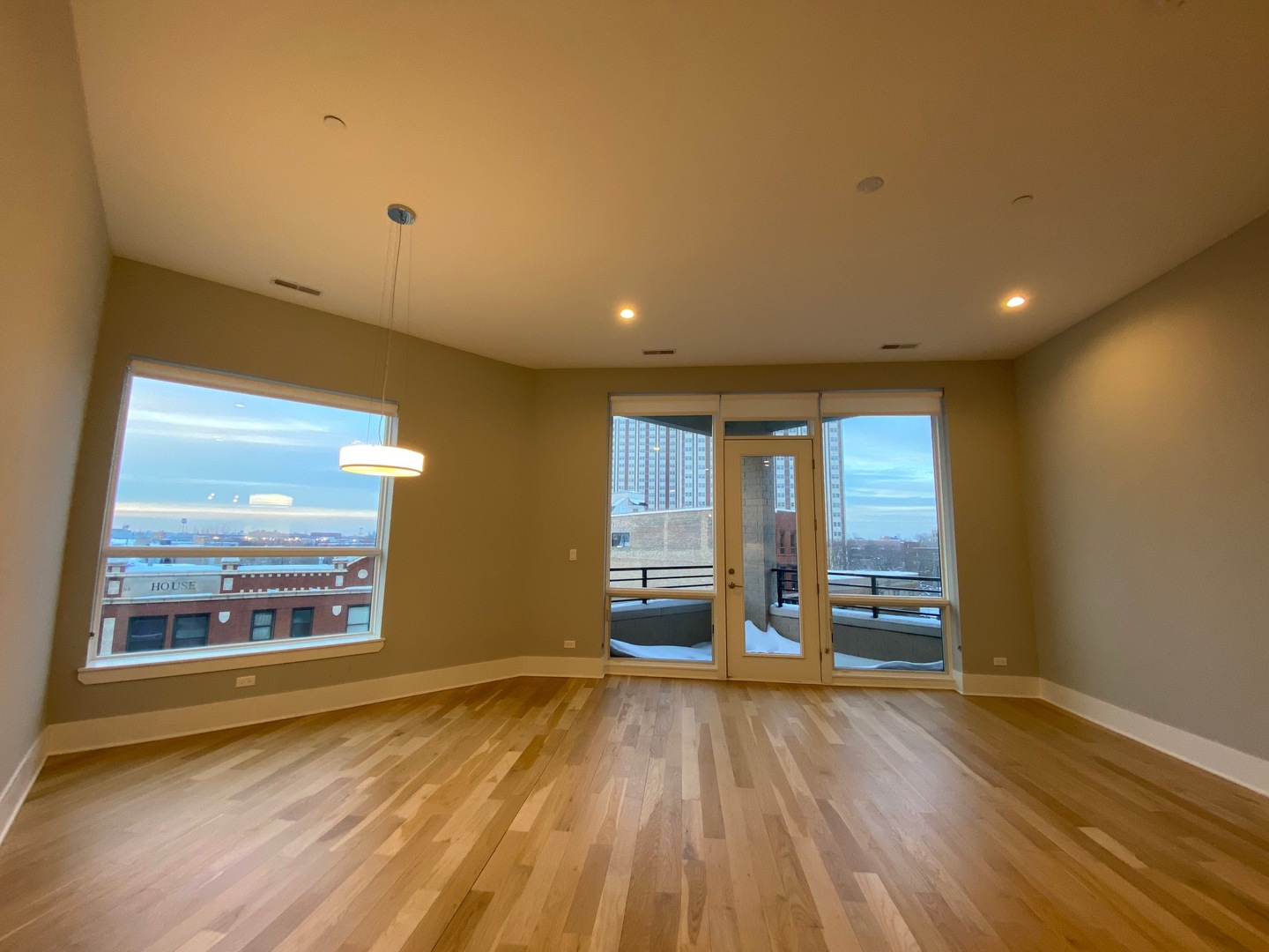 Undisclosed Address Chicago, IL 60612 - Photo 5 of 16 an empty room with wooden floor and windows