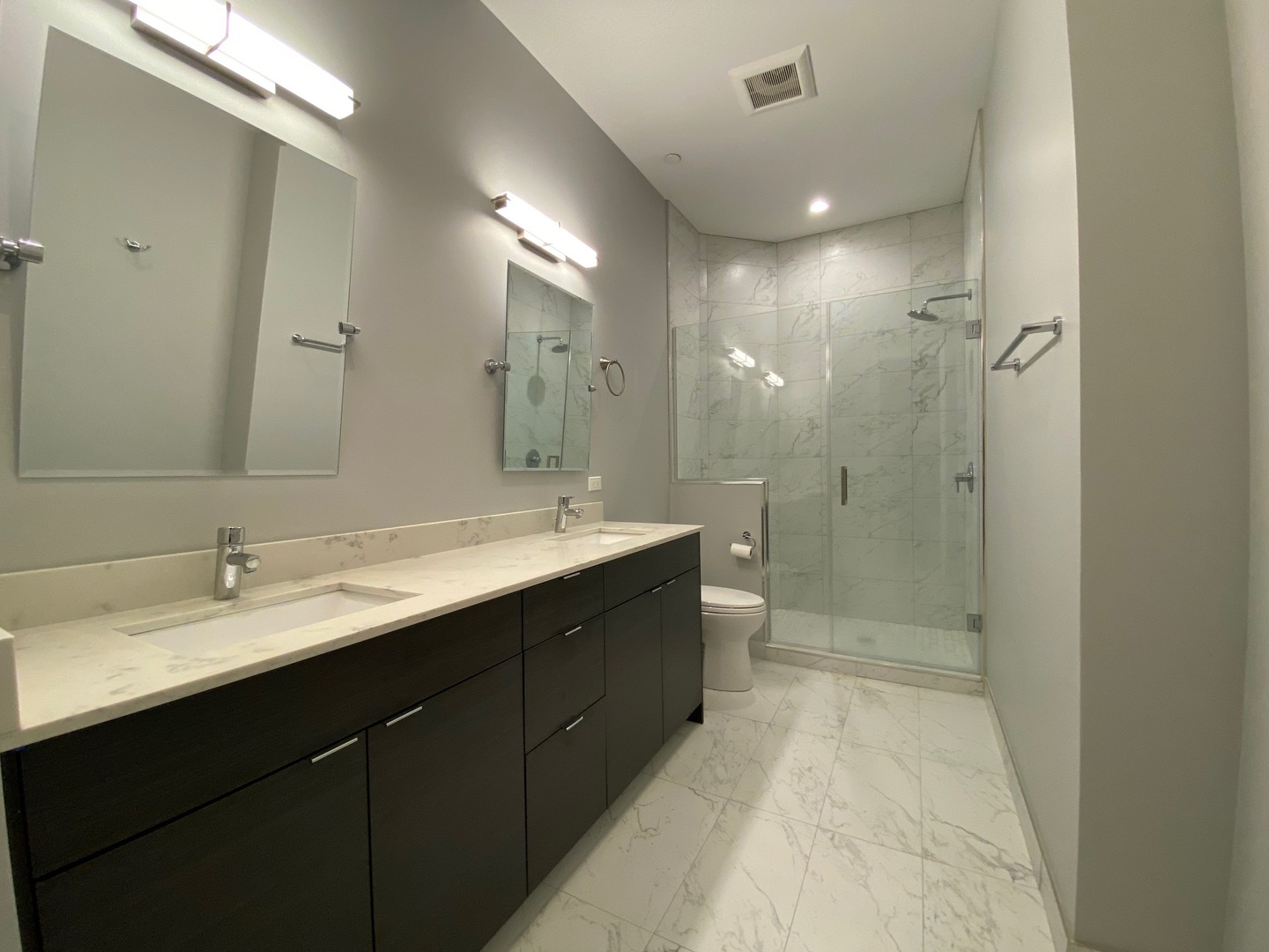 Undisclosed Address Chicago, IL 60612 - Photo 7 of 16 a bathroom with a double vanity sink mirror double and shower