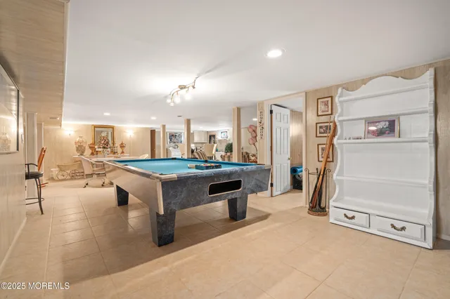 a lobby with furniture and a table