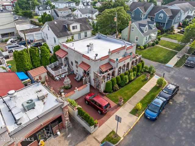 an aerial view of a house with a garden