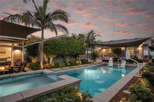 a view of a swimming pool with chairs