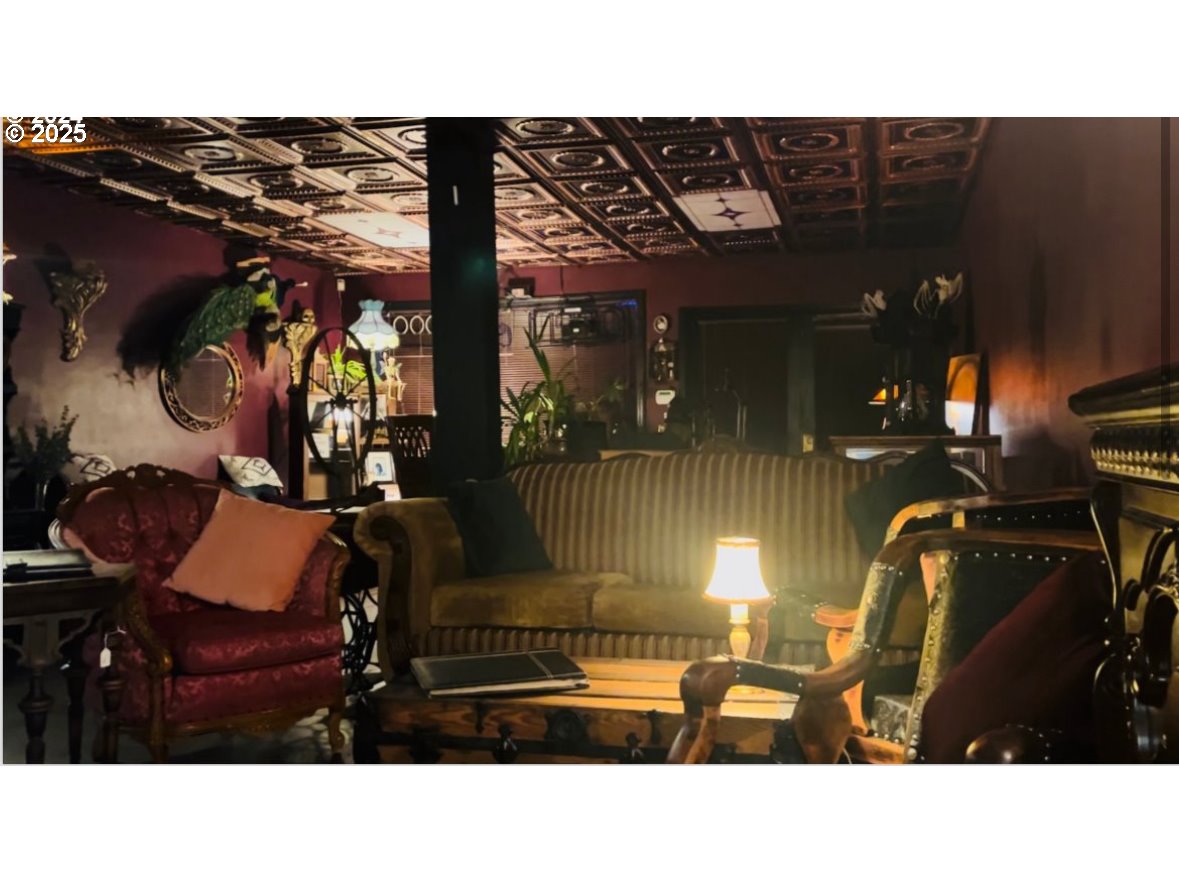 1030 West 5th Avenue Eugene, OR 97402 - Photo 2 of 7 a black and white photo of a living room