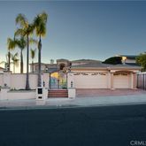 a view of houses with outdoor space and palm tree