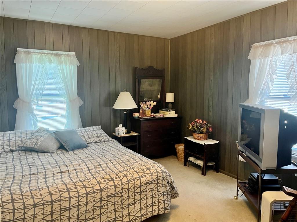 1123 Church Street Indiana, PA 15701 - Photo 12 of 19 a bedroom with a bed and a chandelier