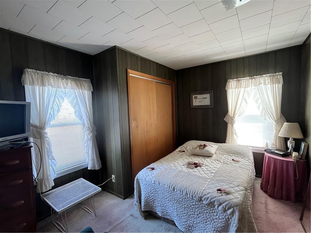 1123 Church Street Indiana, PA 15701 - Photo 13 of 19 a bedroom with a bed and wooden floor