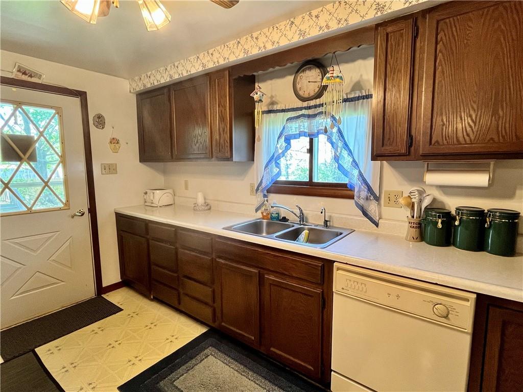 1123 Church Street Indiana, PA 15701 - Photo 6 of 19 a kitchen with stainless steel appliances granite countertop wooden cabinets a sink and a window