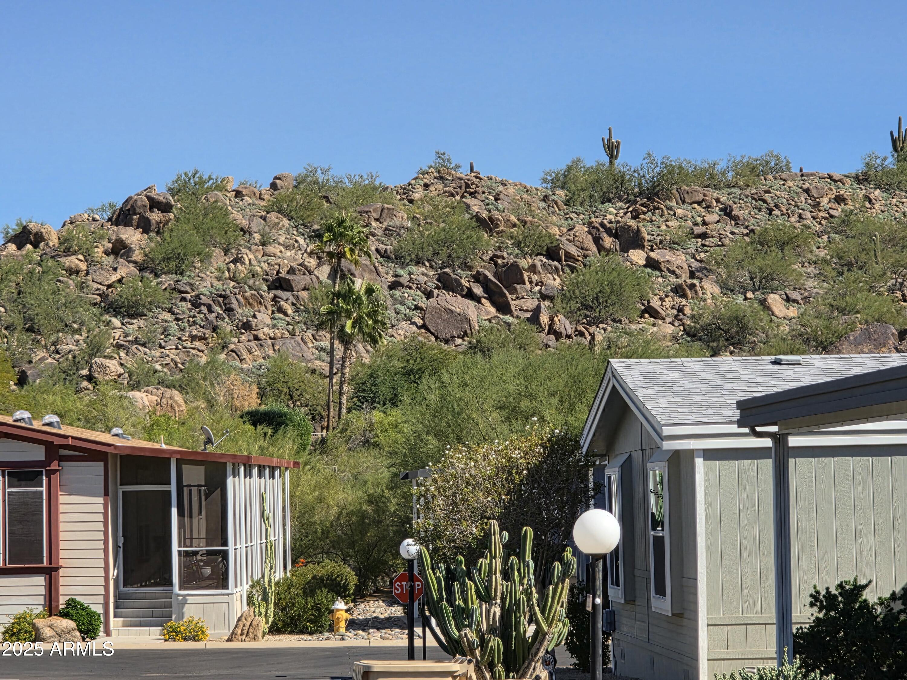 a view of a house with a yard and balcony